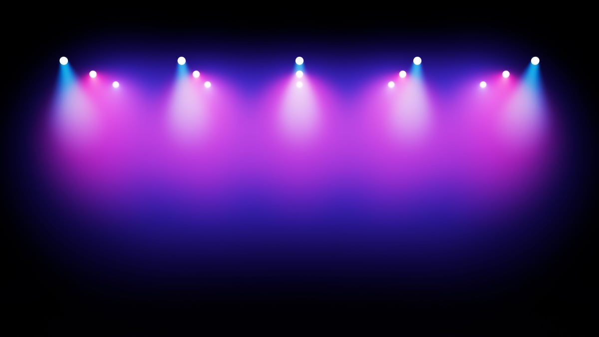 Row Of Bright Stage Spotlights In Shades Of Blue And Pink Illuminating Smoke Against A Dark Background, Suitable For Concert, Event Or Performance Themes